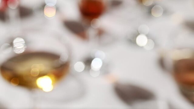 Glasses with different wine types on the table, wine tasting, party and celebration concept.
