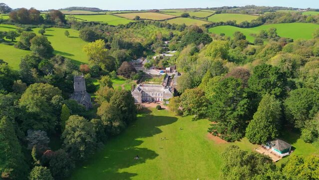 Aerial view of public park, village and Cockington Church in Torquay