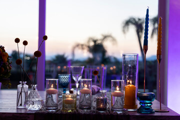 table with lit candles at sunset