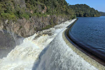 croton reservoir dam with bridge (natural and artifical waterfall in westchester, upstate new york) heavy flow of water © Yuriy T