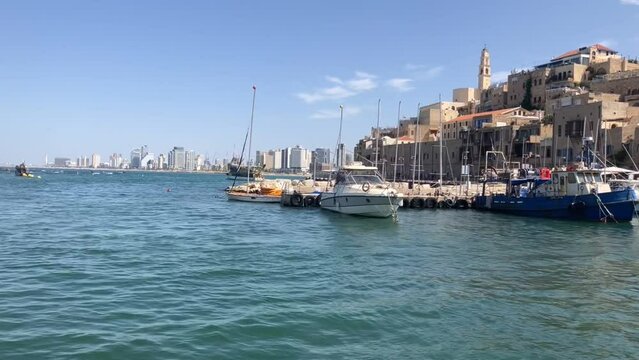 Panorama of ancient Jaffa. View from the sea. Israel sea mooring, old fish boat 