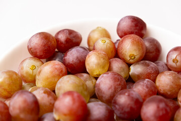 Pink sweet grapes close-up top view
