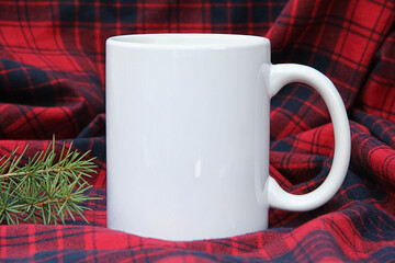  White 11 oz white mug on a green christmas background . 11 oz cup mock up for your cup design - obrazy, fototapety, plakaty