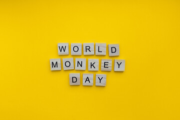 December 14, Monkey Day, minimalistic banner with the inscription in wooden letters