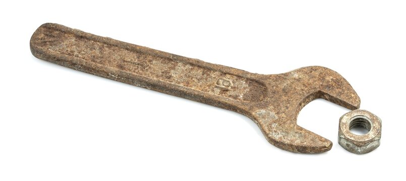 Old wrench on a white background