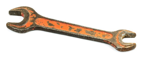 Old wrench on a white background