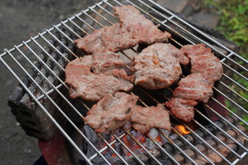 Grilled pork on a rustic stove. Grilled pork. Grilled pork belly.