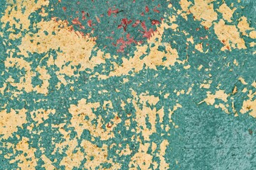 The background is old peeling paint