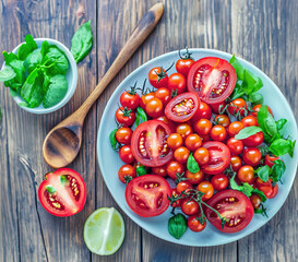 Fresh Tomatoes Elegantly Presented in a Plate with basil on a Wooden Table – High-Resolution Image Perfect for Culinary, Nutrition, and Lifestyle Publications