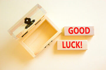 Good luck symbol. Concept words Good luck on beautiful wooden block. Beautiful white table white background. Empty wooden chest. Business, motivational good luck concept. Copy space.