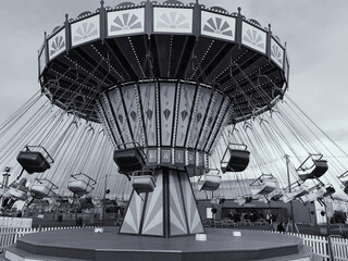 Monochrome picture of a carousel ride in motion