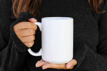  Girl is holding white 15 oz mug in hands with black sweater . large, big, 15oz  blank ceramic cup...