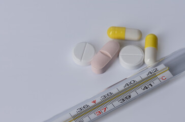 tablets and capsules closeup on white background.,view from above.