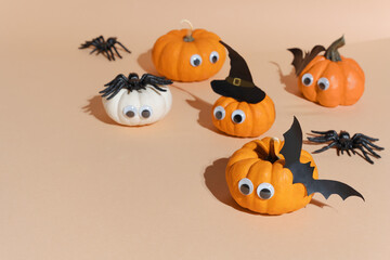 Halloween banner, cute pumpkins with googly eyes. Witch hat. Set orange pumpkin monsters and...