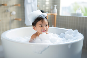 bath time, little asian child boy taking bubble bath in beautiful bathroom, Kids hygiene, Shampoo, hair treatment and soap for children, Kid bathing in large tub , foam in hair