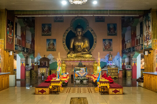 The statue of Buddha and interior of the Buddhist temple (datsan) "Rinpoche Bagsha" in Ulan-Ude, the capital of Siberian Republic of Buryatia, Russia.