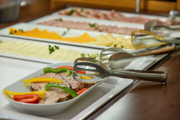 Breakfast in a business hotel, view of the morning food menu.  Small depth of field, detail. 