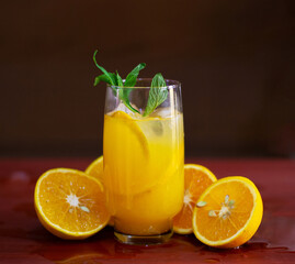 Refreshing orange juice with a garnish of mint leaves 