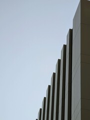 A Minimalist Corner of a Gray Business Center Against a Clear Blue Sky.