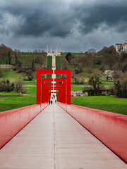 Threatening clouds over the Red Bridge and the 12 columns of the Major Axis in Cergy. Val d'Oise, France