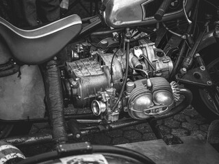 Close-up of the carburetor engine of an old motorcycle, the old motorcycle engine, black and white.
 - obrazy, fototapety, plakaty
