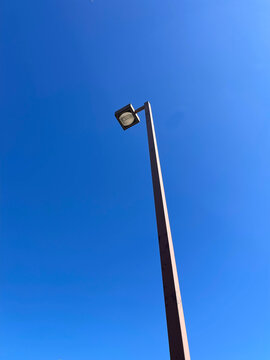 street lamp against blue sky