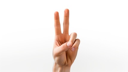 Naklejka premium A hand making the peace sign on white background, victory sign