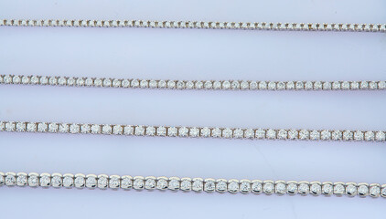 Obraz premium Diamond chain bracelet on light blue background