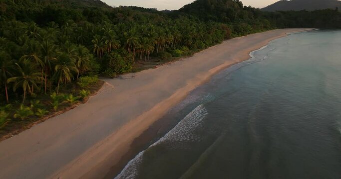 Drone view above the sea of a secret beach in El Nido