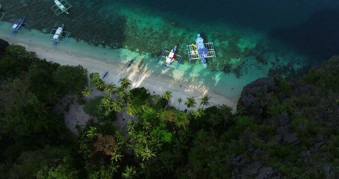 Drone view of traditional boat on a beach in El Nido, Philippines