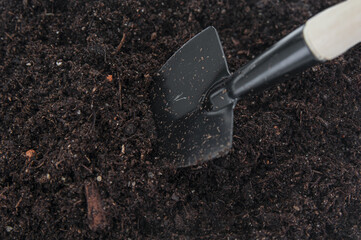 Garden shovel close up in the ground
