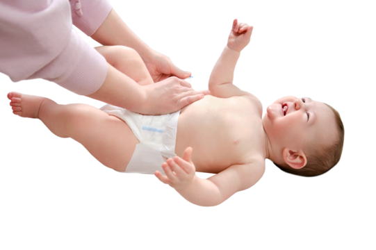 A mother woman puts on a diaper for a baby boy, isolated on a white background. Mom dresses a happy child in clothes. Kid nine months old