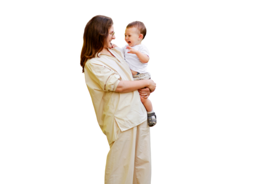 Mother holds a happy toddler boy boy in her arms, isolated on a white background. Mom with a smiling baby in white clothes, one year old kid