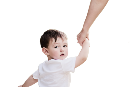 Child boy looks back with fear in his eyes, clutching his mother's hand tightly, isolated on white background. Little baby feels a mix of emotions as he looks back at his mom