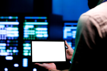 Skillful serviceman conducting annual auditing of data center servers using mock up tablet to...