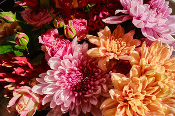 Beautiful bouquet of different flowers. Floral background. Pattern of fresh flowers. Floral card design with dark vintage effect