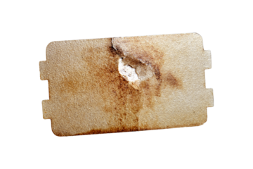Repair of a sparkling microwave by replacing the mica plate, isolated on white background. Broken microwave with self replacement burnt mica sheet