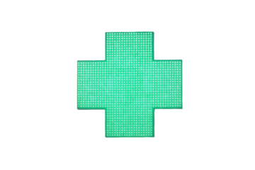 Green cross pharmacy signs on the wall of a city house, isolated on white background