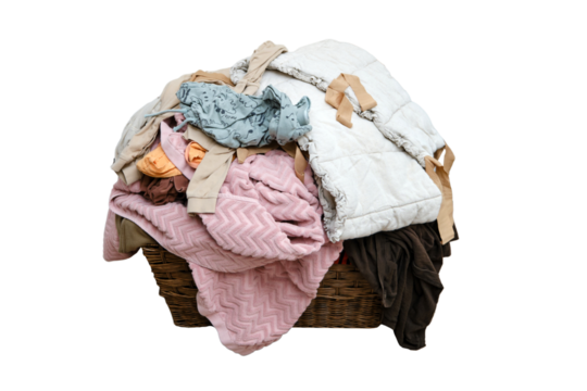 Filling the basket with adult and baby clothing, isolated on white background. Sorting male and female clothes after washing