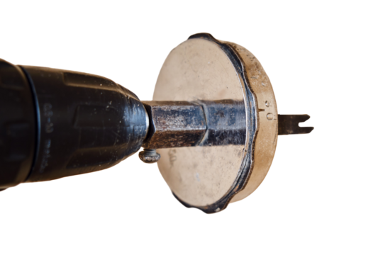 Drilling round holes with a crown on the drill bit. Sawing furniture with a circular saw with a nozzle on an electric screwdriver