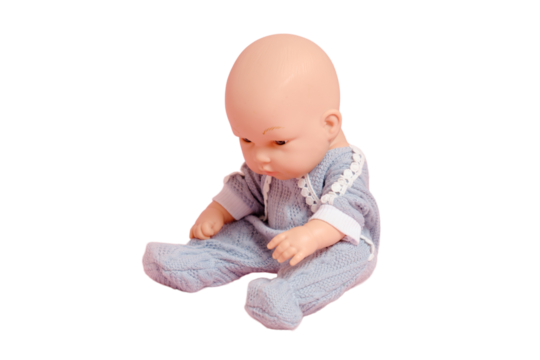 Baby doll with a bald head on a studio, isolated on white background. Children toy without hair, copy space