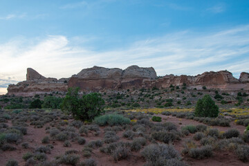 Fototapeta na wymiar SunSet at Canyonlands national park in Utah; the warm golden light illuminates the rock formations. 
