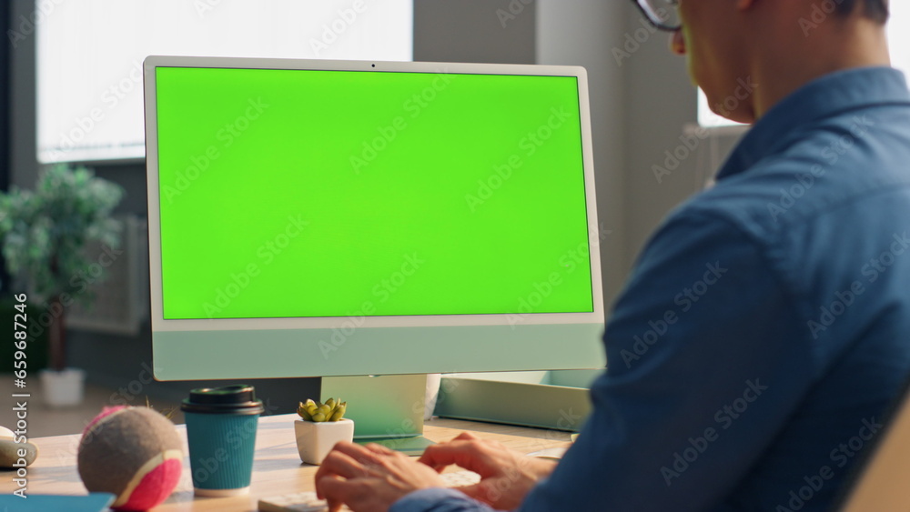 Wall mural freelancer using green screen computer in office close up. business man working