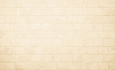 Empty background of wide cream brick wall texture. Beige old brown brick wall concrete or stone textured, wallpaper limestone abstract flooring. Grid uneven interior rock. Home decor design backdrop.