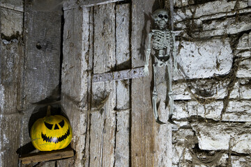 scary Halloween background with Jack'o'lanterns and skeleton