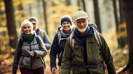 Fototapeta premium group of senior friends trekking. elderly friends hiking outdoor. having fun and smiling. vitality