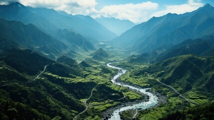 Aerial shot of mountain city with a winding river.UHD wallpaper