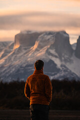 unrecognizable person gazing at the mountains at sunset, Torres del Paine National Park, Chile