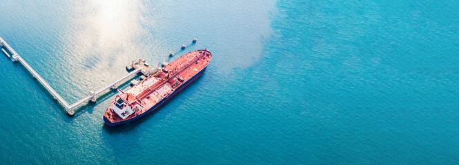 Aerial view of modern sea harbor with transshipment equipment for oil tanker ship, gas offshore...