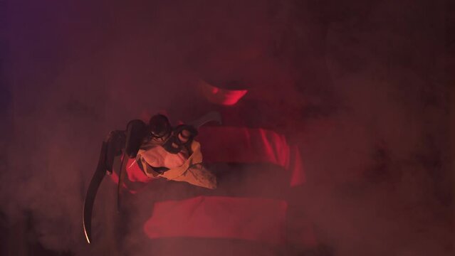 scary hand of  man is like a serial killer freddy with a glove sharp knives in the mist, background for Halloween